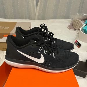 Brand New Size 8 Nike Black Athletic shoes.